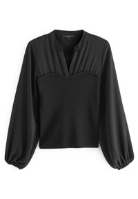 Blouse noire à col haut, corsage plissé et manches bouffantes. Fabriquée dans un tissu lisse avec une texture côtelée sur le devant.