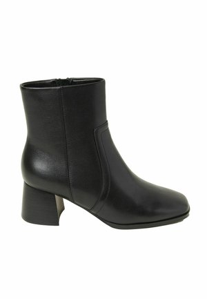 Black leather ankle boot with a square toe, mid-height block heel, and sleek sides. Features a zipper closure for easy access.