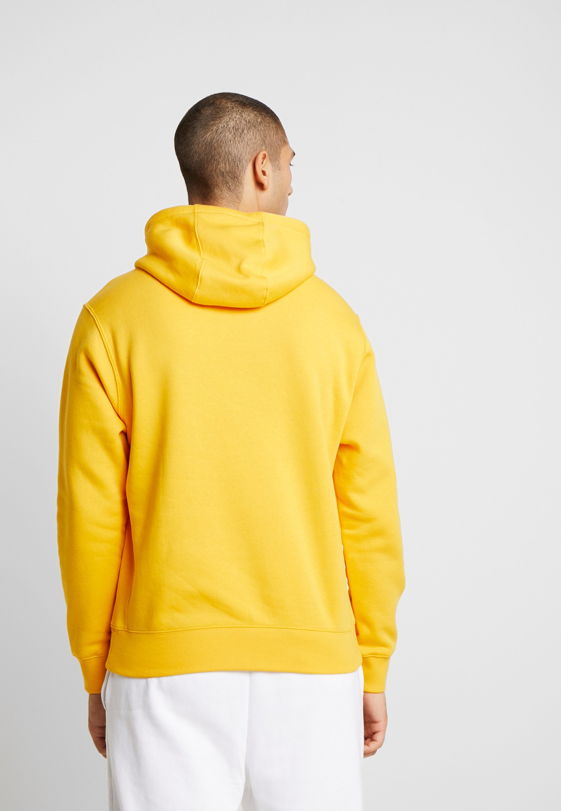 nike club hoodie in mustard