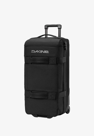 Schwarze Dakine Reisetasche mit Rollen, Teleskopgriff, zwei Tragegriffen und seitlichen Gurten zum Komprimieren oder Tragen.