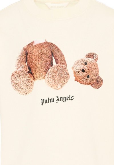 Pluszowy miś z odłączoną głową nadrukowany nad napisem "Palm Angels" na beżowej koszulce.