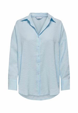 Cămașă bleu deschis, cu mâneci lungi, nasturi și guler clasic, cu o croială ușor supradimensionată și un material moale, texturat. Detaliu cu tiv rotund.