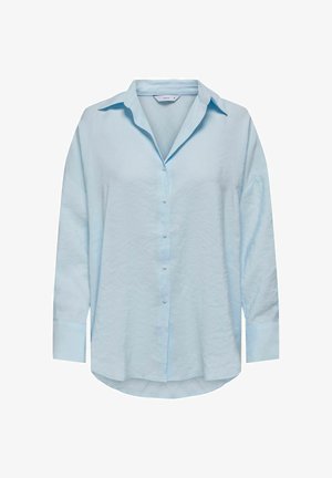 Lys blå, langermet skjorte med knappestolpe og klassisk krage, lett oversized passform og et mykt, teksturert stoff. Runde kantdetaljer.