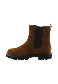 Brune ruskinds Chelsea-støvler med en sort elastisk panel, rund tå, perforerede detaljer og en robust sort sål.