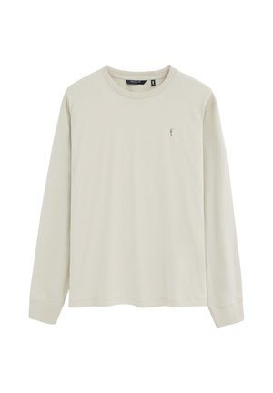 Beige shirt met lange mouwen en een ronde hals met een klein geborduurd logo op de linkerborst en geribbelde manchetten.