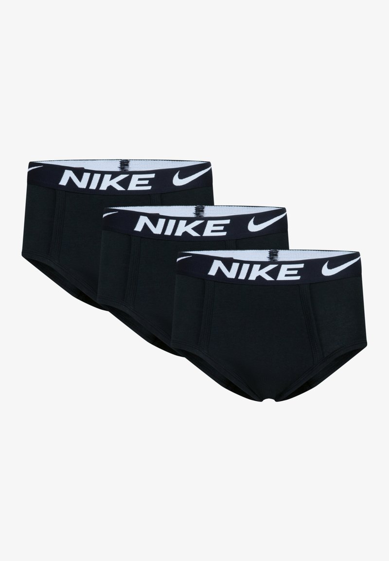 Tre paia di mutande in cotone nero stile slip con una cintura bianca con il logo Nike. Presentano una texture liscia e un design aderente.