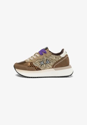 Brown sneaker with glittery gold panel, leopard print detail, beige and purple laces, white sole, and black geometric logo on side.