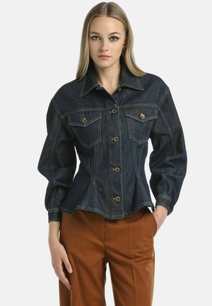 Dark denim jacket featuring a fitted design, pointed collar, front pockets, and button closure. Long, puffed sleeves with cuff detailing.