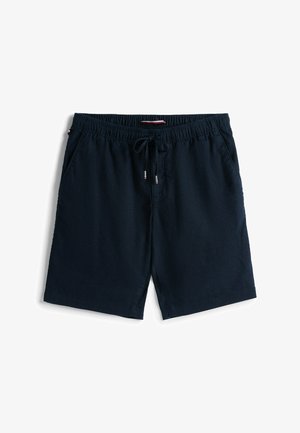 Marineblauwe shorts gemaakt van een lichtgewicht stof met een elastische tailleband, trekkoordsluiting en zijzakken. Gladde textuur en eenvoudig ontwerp.
