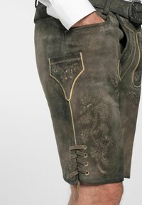 Braune Lederhosen aus Leder mit kunstvollem floralem Stickerei, einer Seitenasche und Spitzenverzierung am Saum. Texturierte, weiche Wildleder-Oberfläche.