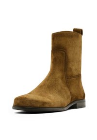 Kastanienbrauner Chelsea-Stiefel aus Wildleder mit glatter Oberfläche, abgerundeter Spitze und minimalen Nähten. Verfügt über einen niedrigen schwarzen Absatz und eine Anziehhilfe.