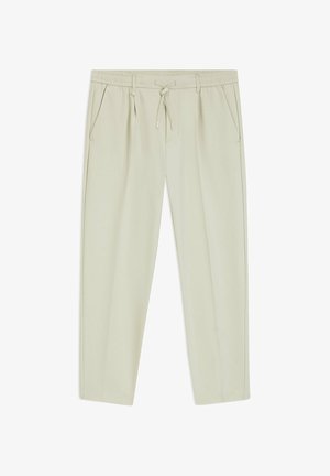 Pantalon décontracté beige clair avec taille élastique, cordon de serrage, poches latérales et jambes droites.