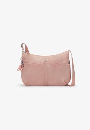 Sac bandoulière rose clair avec sangle réglable, deux poches avant zippées et un petit porte-clés singe suspendu sur la fermeture éclair gauche.