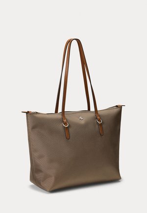 Brown tote bag in textured material with brown leather handles, silver hardware accents, and a logo detail on the front.