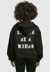 Merchcode WD - STRONG AS A  - Kapucni - black
