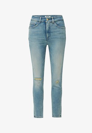 Jean en denim bleu clair avec une taille haute, coupe skinny et détails déchirés, présentant des déchirures et des réparations aux genoux.