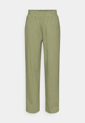 Pantaloni de trening verde deschis cu talie elastică, croiala largă, picioare drepte și textură netedă. Fără modele vizibile sau accesorii.
