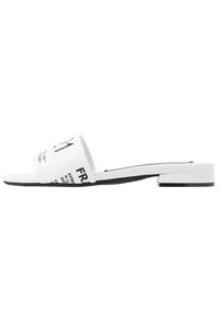 White slide sandal with a flat heel, featuring a wide strap displaying black text and a smooth texture. Black sole accent at the heel.