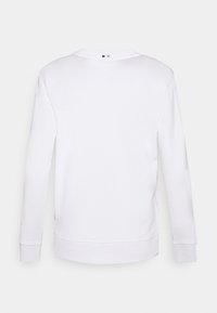 Sweat-shirt blanc à manches longues avec col rond, poignets et ourlet côtelés, vu de dos sur un fond clair et épuré.