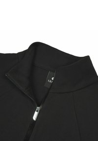 Black zip-up collar jacket made of fabric with a smooth texture. Features a metallic zipper and a tag with brand name inside the collar.