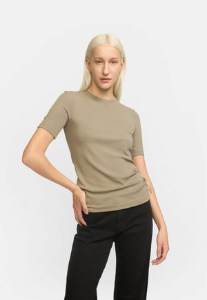 Khaki ribbed t-shirt with a crew neckline and short sleeves, paired with black pants. Smooth texture, fitted style, minimalistic design.