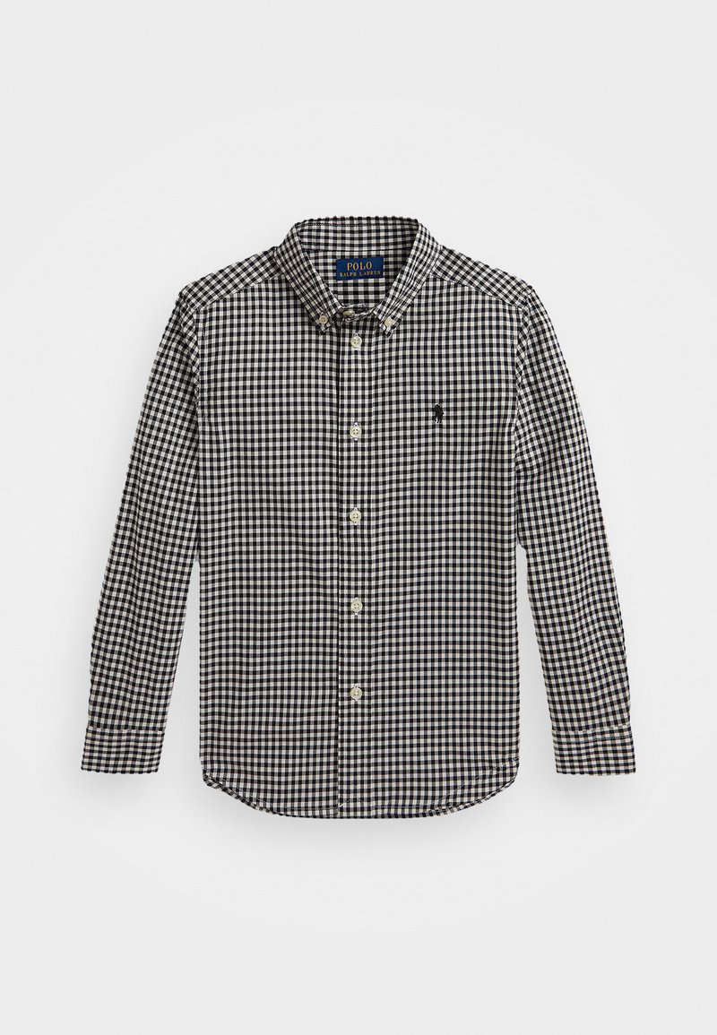 Καρό πουκάμισο με μακριά μανίκια σε μαύρο και άσπρο. Κλειστό γιακάς, μπροστινή κουμπωτή κλεισίματος, κλασική εφαρμογή και κεντημένο λογότυπο στο στήθος.
