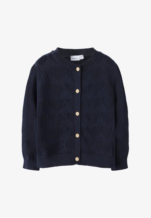 Cardigan lavorato a maglia blu navy con motivi a cuore, scollo rotondo e sei bottoni in legno sul davanti. Polsini e orlo a coste.
