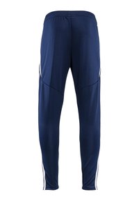 Marineblauwe sportbroek van lichtgewicht stof, met een zachte textuur, taps toelopende pijpen en witte zijstrepen voor contrast.