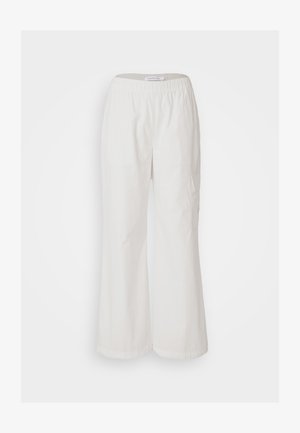 Valged lai jalad, valmistatud kergest kangast. Omab elastset vööd ja külgtaskut, sile tekstuur. Igapäevane disain.