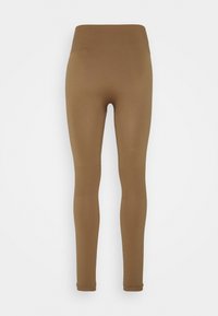 Leggings marroni con una vita alta, texture liscia e pannelli in rete sui polpacci. Design aderente con un aspetto senza cuciture.