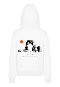 White hoodie featuring a graphic of an arch with a red sun. Text reads "ESCAPE AND DISCOVER THE WORLD." Material appears smooth and casual.