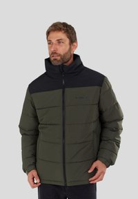 Green puffer jacket with black shoulders, zip closure, and high collar. Features horizontal stitching and a smooth texture.