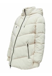 Doudoune beige clair avec un motif de quilting diagonal, fermeture éclair à l'avant, deux poches latérales zippées et une capuche doublée.