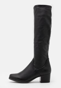 Bottes noires montantes jusqu'aux genoux en cuir synthétique. Caractérisées par un bout carré, un talon bloc modeste et un détail minimaliste de coutures.
