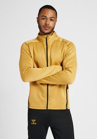 Hummel JACKET - Trainingsjacke - antique gold