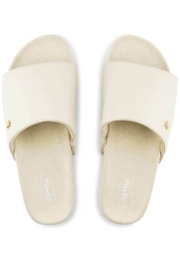 Light beige slide sandals featuring a wide synthetic strap, soft suede footbed, and a small gold accent detail on the side.