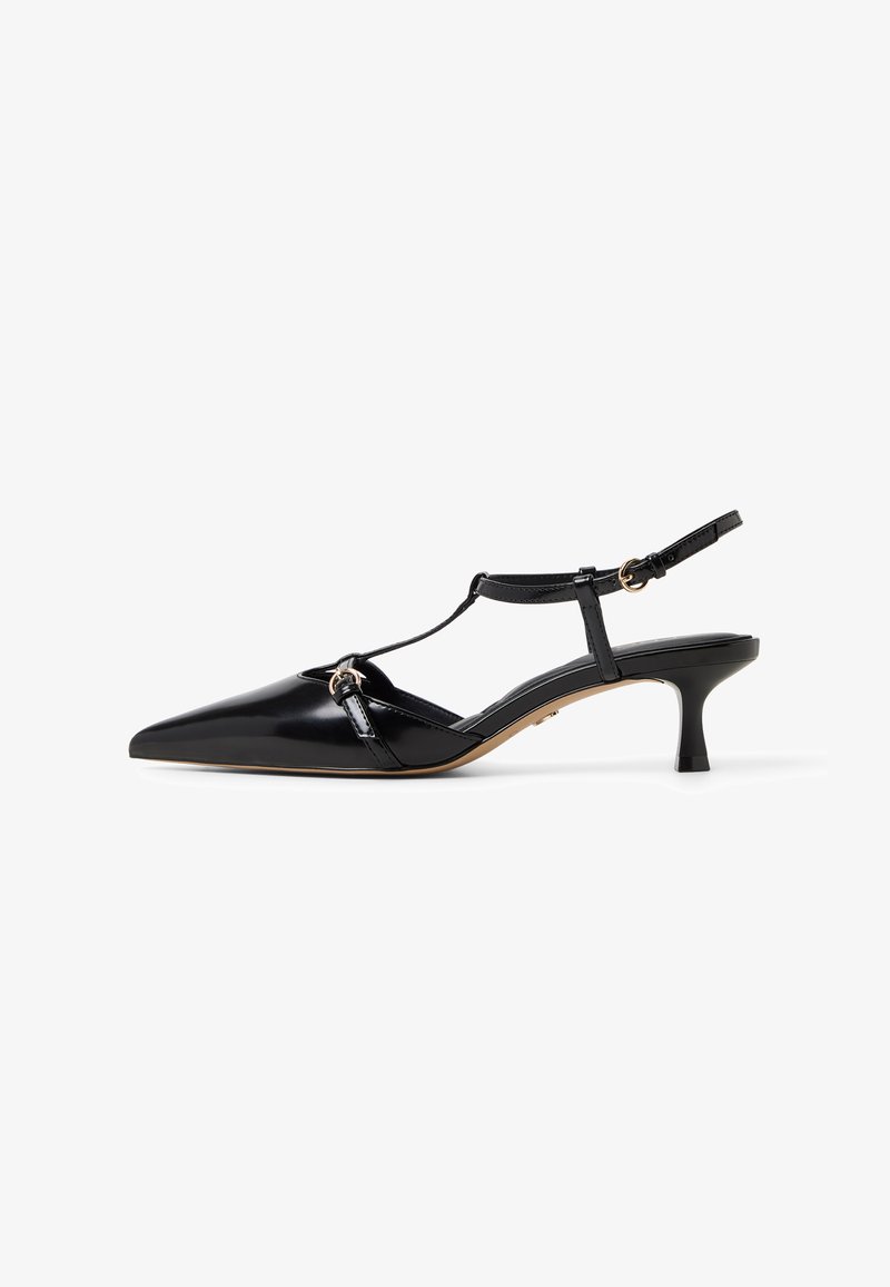 Black patent leather slingback heels with a pointed toe, T-strap design, adjustable ankle strap, and a mid-height block heel.