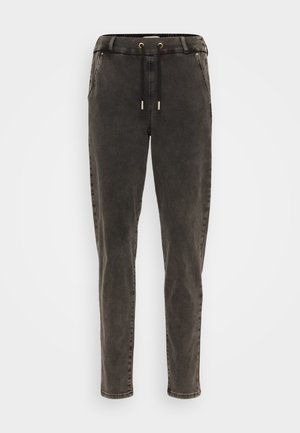 Dark gray pants made from soft cotton blend, featuring a drawstring waist, side pockets, and tapered legs with a smooth finish.