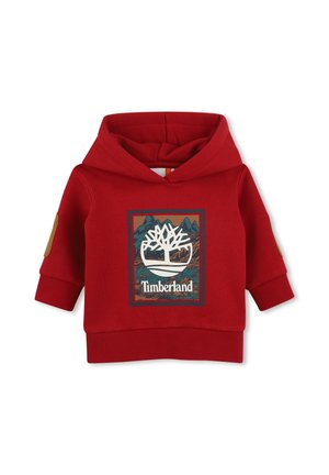 Sweat à capuche rouge pour enfants avec logo Timberland et motif montagne sur le devant, poignets côtelés et patchs aux coudes sur les manches.