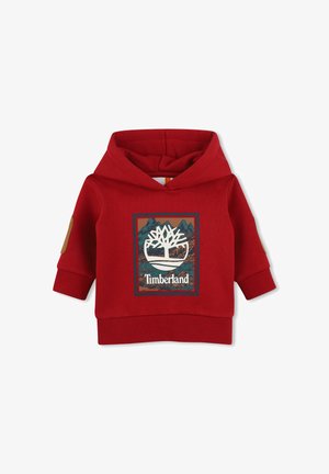 Rode kinderhoodie met Timberland-logo en bergafbeelding op de voorkant, geribde manchetten en elleboogstukken op de mouwen.
