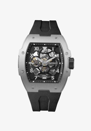 Zwarte rubberen horloge met een transparante skeleton wijzerplaat, zilveren roestvrijstalen kast, gedurfde uurmarkeringen en zichtbare bewegingsmechanismen.