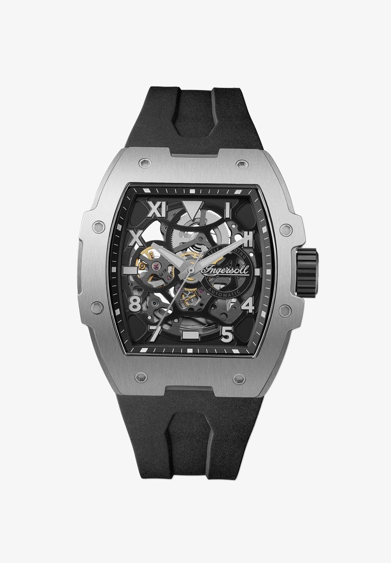 Automatisch horloge met een zwarte rubberen band, roestvrijstalen kast, skelet wijzerplaat, zilveren uur- en minutenwijzers en opvallende uurmarkeringen.