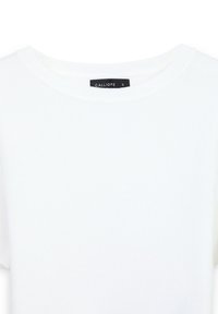 Top corto a maniche corte in maglia bianca a coste con scollatura rotonda, etichetta nera con scritto "CALLIOPE" che indica la taglia "S".
