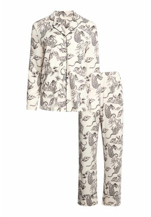 Roomwit, lange mouwen pyjama set met zwarte bies, voorzien van overalluipaard- en bladprint op het knoopsluitende shirt en broek met elastische tailleband.