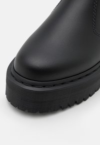 Dr. Martens Botines con plataforma - black