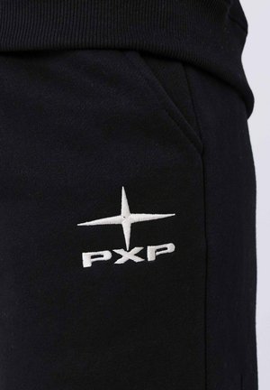 Pantalons de jogging noirs en tissu mélangé coton, avec une taille en bord-côte et une poche latérale. Logo "PXP" brodé en blanc avec un accent étoile.