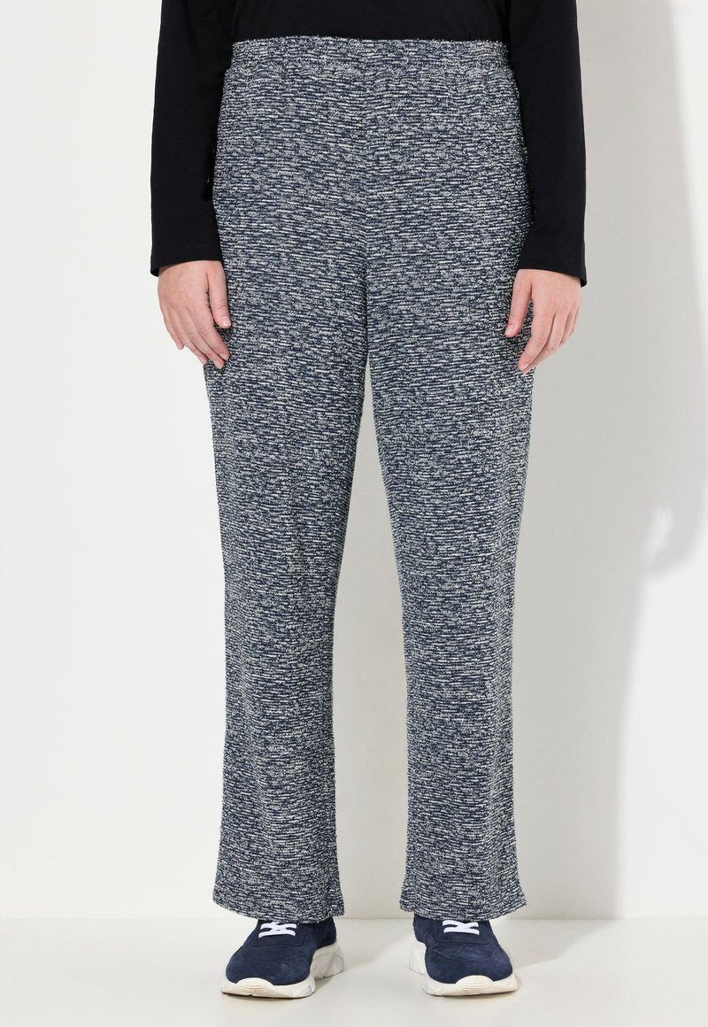 Marineblauwe en grijze gebreide broek met een licht gestructureerde stof, voorzien van een elastische tailleband en een rechte pijpdesign.