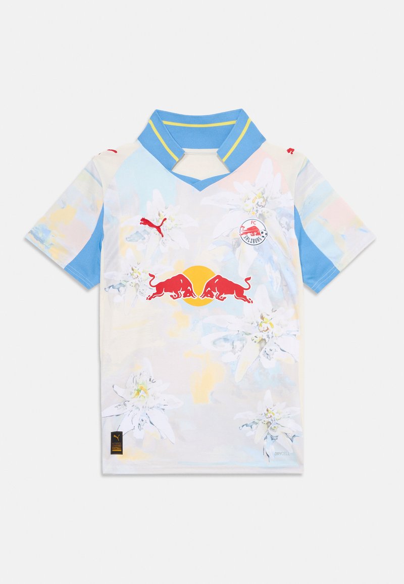 Maillot à manches courtes Puma dans des teintes pastel avec un motif floral, un col en V avec des accents bleus, et un logo rouge sur la poitrine.