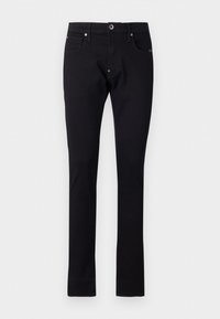 Jean en denim noir à coupe slim, avec une fermeture à bouton et à glissière, cinq poches et des détails de couture subtils. Texture lisse.