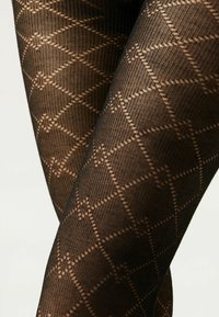 Collant neri a motivo con design a diamante in una tonalità marrone chiaro a contrasto, realizzati in un materiale testurizzato e stretch.